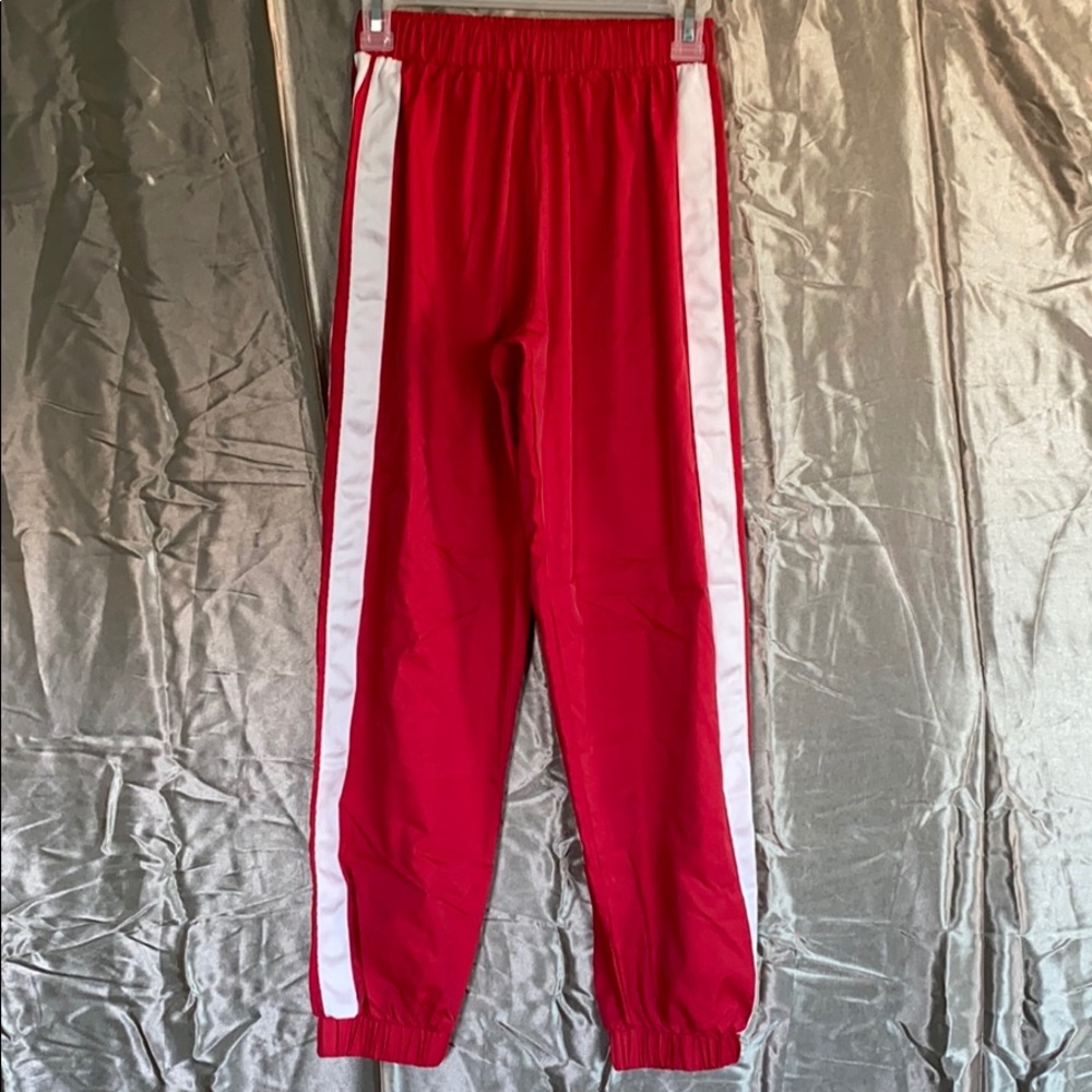 Red track pants